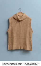 Hanging With Brown Sweater Vest –blue Background