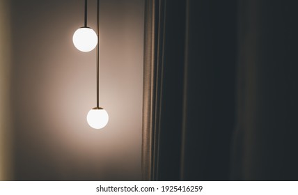 hanging ceiling light lamp decorated at corner of bedroom with grey curtain, interior concept - Powered by Shutterstock