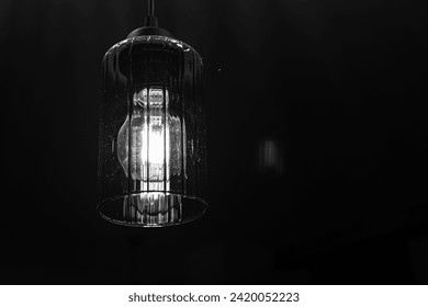 hanging dangling ceiling scones in front of a dark background