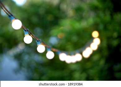 Hanging Decorative Christmas Lights For A Back Yard Party