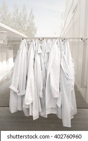 Hanging Farm Lab Coats  In Glasshouse  Wait For Clean