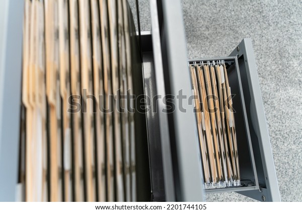 Hanging files in
filling cabinet with
documents