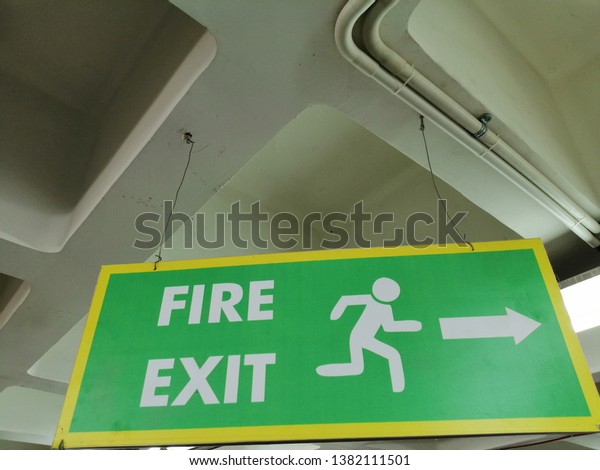 Hanging Fire Exit Sign Board Inside Stock Photo Edit Now 1382111501