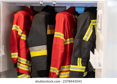 Hanging firefighter jackets and helmets. - Powered by Shutterstock