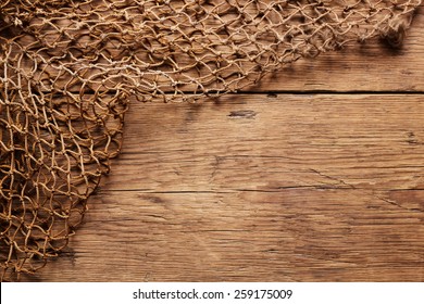 Hanging Fishnet on Wood Wall
