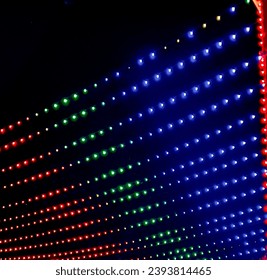 Hanging Horizontal multicolor string lights in sky at night.wedding decoration.