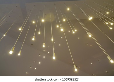 Hanging lights on ceiling. Interior concept for modern buildings.