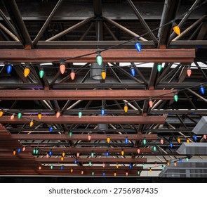 Hanging multi colored string lights in the roof