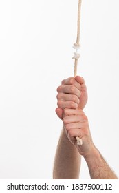 Hanging on by a thread, hand holding a frayed rope - Shutterstock ID 1837500112