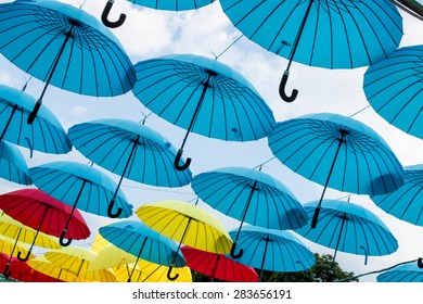 Hanging  opened colored umbrellas 