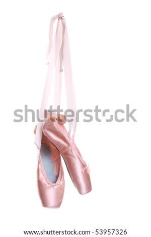 Hanging pink ballet shoes isolated on a white background