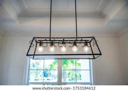 Hanging retro black metal iron chandelier lighting fixture with vintage bulbs 