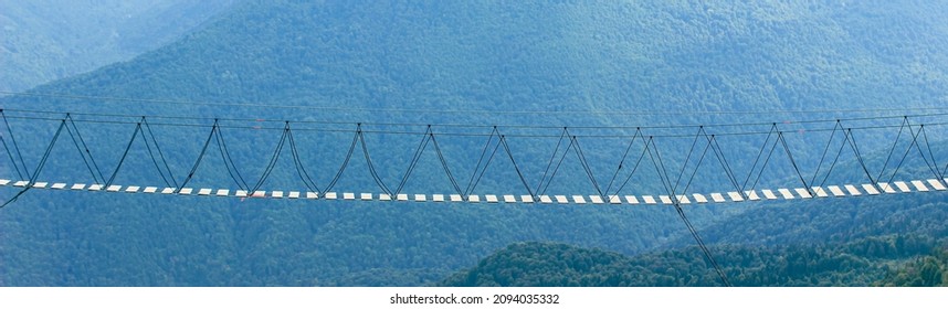 Hanging Rope Bridge For Extreme Walking In The Mountains. Banner, Close Up