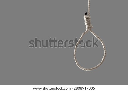 Hanging rope with loop on grey background. Suicide concept
