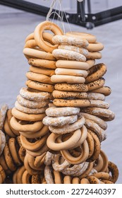 Hanging Sushki, traditional Russian, also Ukrainian and Lithuanian, Eastern European small, crunchy, mildly sweet bread rings in a street food regional market, vertical
