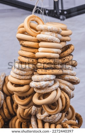Hanging Sushki, traditional Russian, also Ukrainian and Lithuanian, Eastern European small, crunchy, mildly sweet bread rings in a street food regional market, vertical