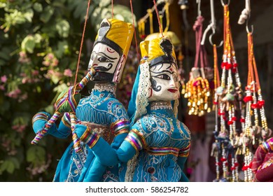 Hanging Of Tradition India Doll In Display Shopfront In Dilli Haat, Delhi, India. Dilli Haat Is Traditional Marketplace In Delhi