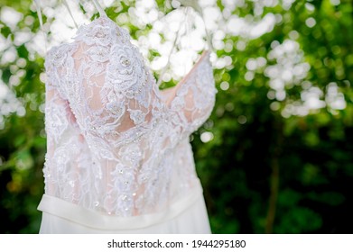 Hanging wedding dress in nature 