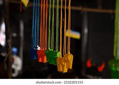 Hanging whistles of different colors