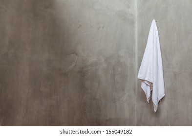 Hanging White Towel Near The Corner of Bath Room Wall - Powered by Shutterstock