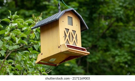 A Hanging Yellow Bird House 