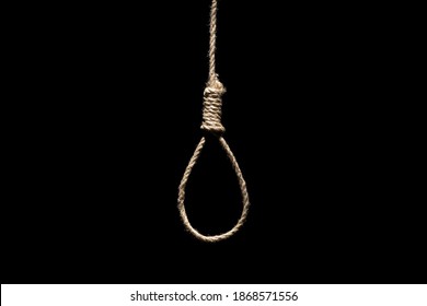 Hangman's Loop On The Black Background. Capital Punishment, Suicide Attempt And Death Penalty By Hanging Concept With Rope Tied Into A Noose Isolated On Black Background.