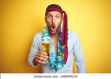 Hangover business man drunk and crazy for hangover wearing tie on head drinking beer scared in shock with a surprise face, afraid and excited with fear expression - Shutterstock ID 1484999219