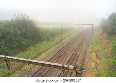 Hangs A Thick Fog Along The Road And Rail