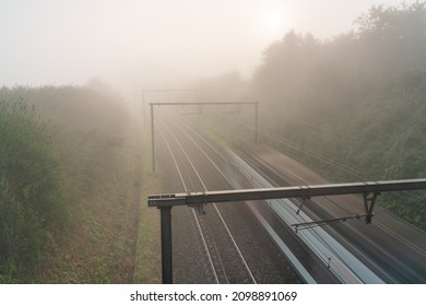 Hangs A Thick Fog Along The Road And Rail