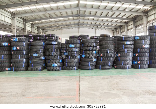 Hangzhou, China - on\
July 24, 2015: North train station freight warehouse goods piled up\
many  car tires, North train station is a large Cargo transfer\
station in hangzhou.
