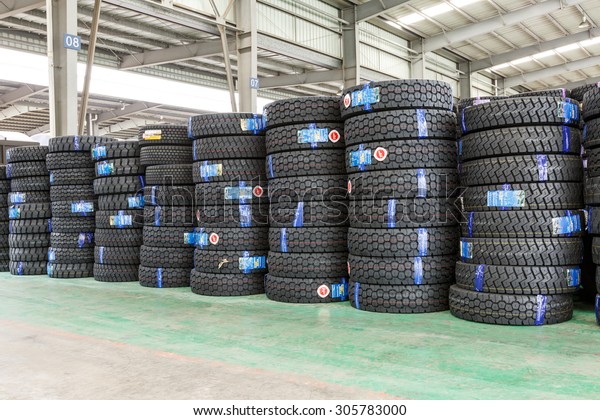 Hangzhou, China - on\
July 24, 2015: North train station freight warehouse goods piled up\
many  car tires, North train station is a large Cargo transfer\
station in hangzhou.