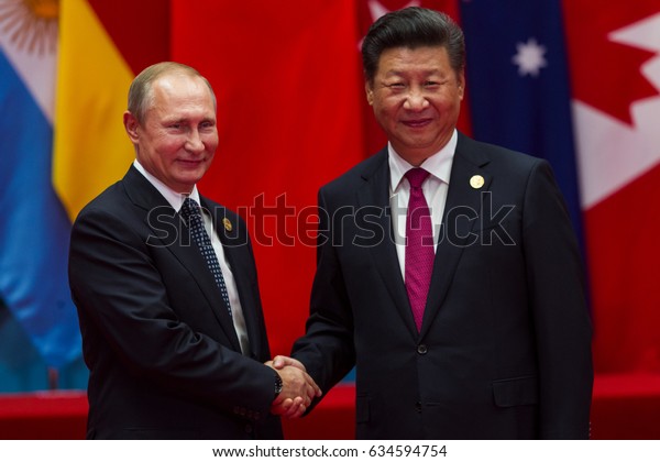 HANGZHOU, CHINA - SEPT. 4. 2016 - Chinese\
president Xi Jinping (R) welcomes Russian President Vladimir Putin\
(L) in G20 summit in\
Hangzhou.