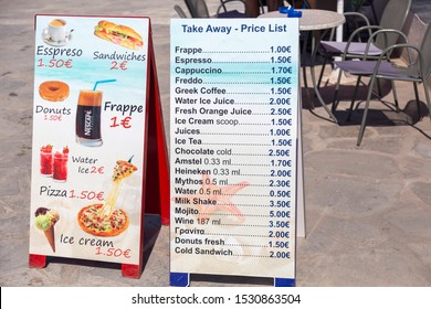 HANIOTI, GREECE - AUGUST 08, 2019: Beach Shop Sign, Price List For Refreshments At Beach Snack Bar. Beach Bar Menu On Blackboard 