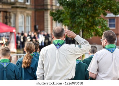 Hanley, Stoke On Trent, Staffordshire - 11th November 2018 - A Cub Scout Leader Salutes During The 100 Year Remembrance Day Parade, Service In  Albion Square, Hanley