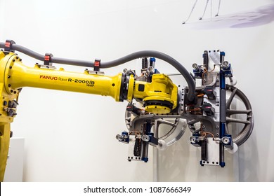 Hannover, Germany - April, 2018: Automatic Industrial Robot Fanuc R-2000iB concept auto service working process on Messe fair in Hannover, Germany
