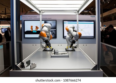 Hannover, Germany - April, 2018: Future of automation, autonomous system with Kuka robots on Siemens stand on Messe fair in Hannover, Germany