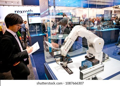 Hannover, Germany - April, 2018: Mitsubishi robot arm on Schunk stand on Messe fair in Hannover, Germany