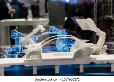 Hannover, Germany - April, 2018: Simulating of car manufacturing by robots, digital twin of the production on Siemens stand on Messe fair in Hannover, Germany