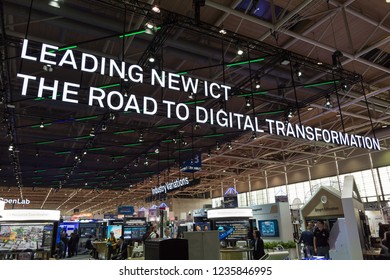 Hannover, Germany - June 13, 2018: Big neon sign in top of the huge booth of Huawei at CeBIT 2018. CeBIT is the world's largest trade fair for information technology.