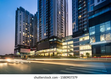 Hanoi Cityscape At Twilight With Asphalt Road And Modern Buildings On Background