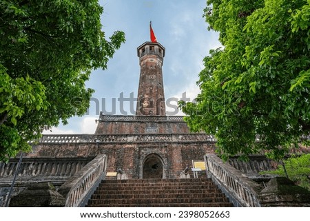 Hanoi flag tower with Vietnamese flag on top. This tower is one of the symbols of the city and part of the Hanoi Citadel, a World Heritage Site. A well known destination for tourist in Hanoi, Vietnam