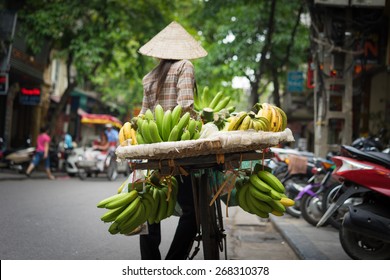 Hanoi fruit vendor with vignette effect added - Powered by Shutterstock