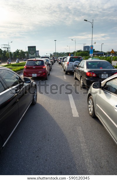Hanoi, Vietnam - Cars in traffic during\
rush hour in Co Linh street, Long Bien\
district