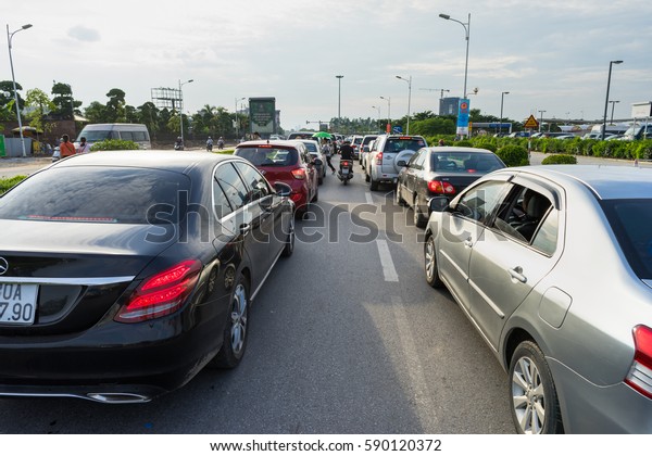 Hanoi, Vietnam - Cars in traffic during\
rush hour in Co Linh street, Long Bien\
district