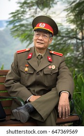 Hanoi, Vietnam - Dec 19, 2016: Portrait Of Old Vietnamese Veteran Sitting At Hoan Kiem Lake, Center Of Hanoi