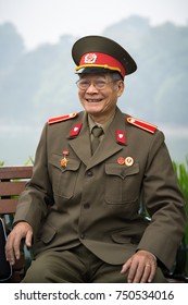 Hanoi, Vietnam - Dec 19, 2016: Portrait Of Old Vietnamese Veteran Sitting At Hoan Kiem Lake, Center Of Hanoi