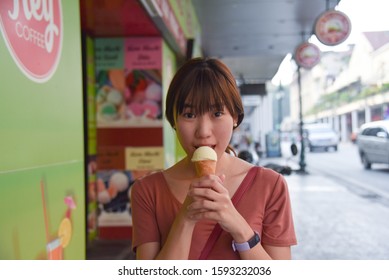 Hanoi, Vietnam : December 1st 2019 : Asian Girl Holding An Ice Cream, Trang Tien, Famous Vietnam Ice Cream.