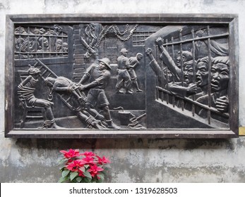 Hanoi/ Vietnam - February 4th 2019: Relief on the wall of the Hanoi Hilton/ Vietnam Military History Museum showing scene of torture as a memorial of former war crimes