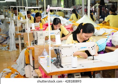 HANOI, VIETNAM - JUNE, 10, 2013: Workers Work In A Garment Factory.