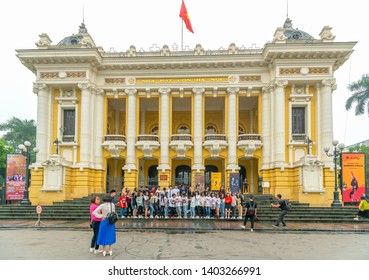 Hanoi, Vietnam - March 31, 2019: Group  Students Traveling To Gather Photos Yearbook Front Of Opera House. It Was Built By French In 1901 And Now Still Place For Big Cultural Events In Hanoi,Vietnam